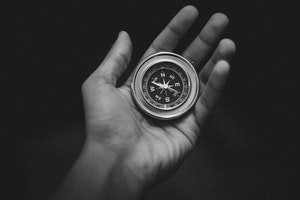 compass held in palm of hand