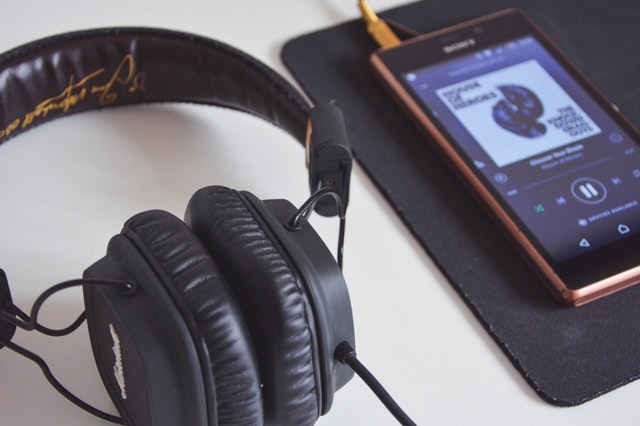 close up of headphones and smartphone
