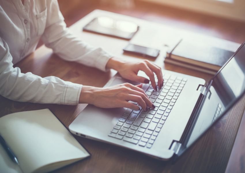 Image of woman typing on computer