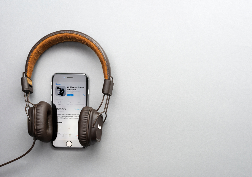 image of headphones and podcast player