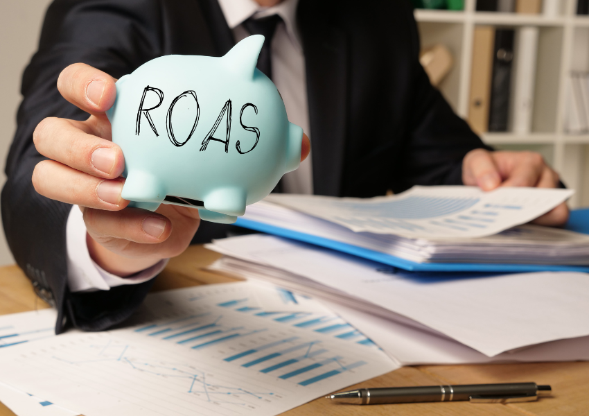 image of person holding piggy bank